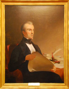 Portrait of James K. Polk sitting in a chair looking to the right.